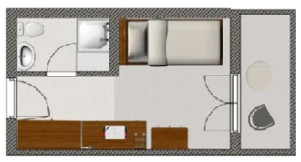 Grundriss eines kleinen Zimmers mit einem Einzelbett, einem Tisch, einem Stuhl und einem Badezimmer. An einer Wand befindet sich eine Toilette. Der Raum hat einen einfachen, funktionalen Stil.